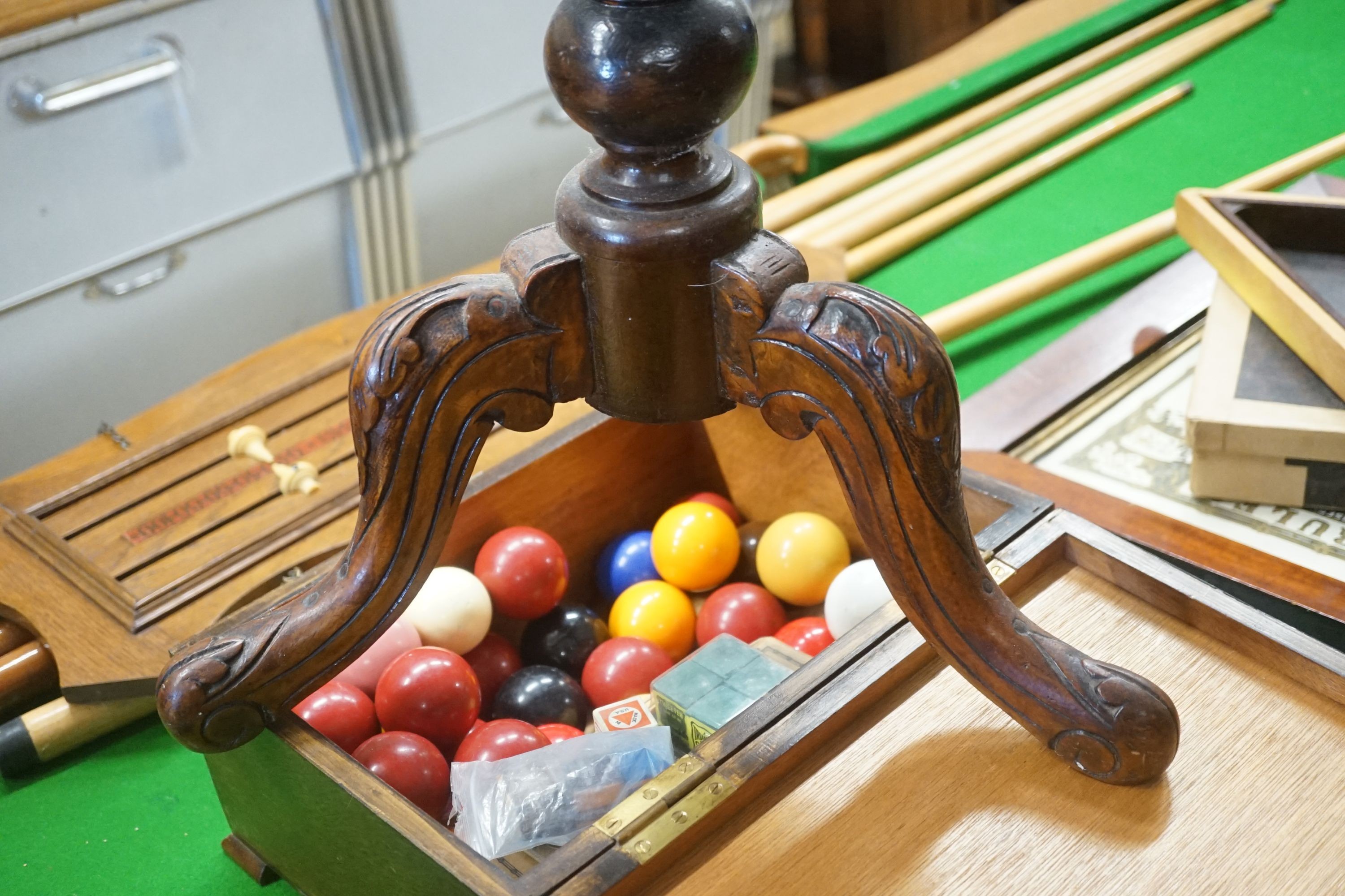 A Victorian octagonal walnut tripod games table, width 50cm height 67cm